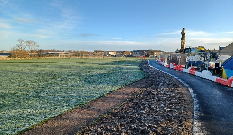 Work to refurbish Esk Waste Water Pumping Station in Musselburgh is underway The newly paved walkway at the perimeter of the site of works at Esk Waste Water Pumping Station in Musselburgh is shown. The works are adjacent to a playing field.