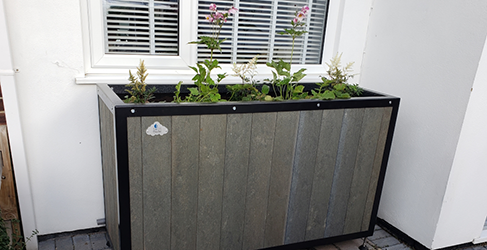 Rainproof Prestwick planter example of a planter installed on a property to capture roof run off