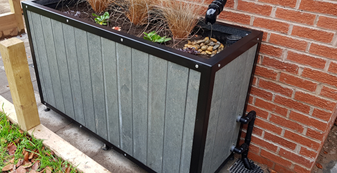 Rainproof Prestwick planter example of a planter installed on a property to capture roof run off