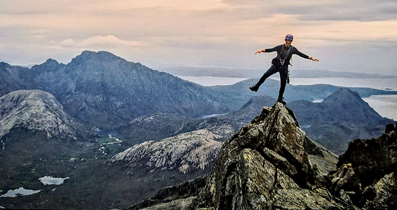 WaterAid at 30 Mountaineer Tom Millar founder Munro Challenge WaterAid balancing on one leg at the summit of Sgurr nan Gillean