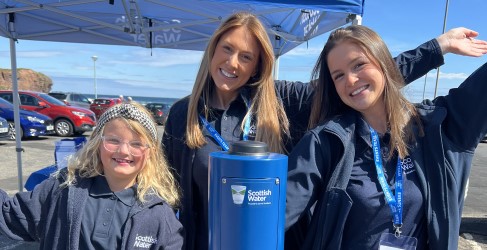 Three Scottish Water employees happy beside Top Up Tap Three Scottish Water employees happy beside Top Up Tap