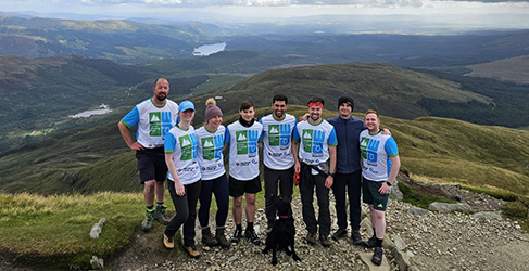 Munro Challenge 2024 complete Ross-shire Engineering team at the summit of a cairngorm as part of the Munro Challenge 2024